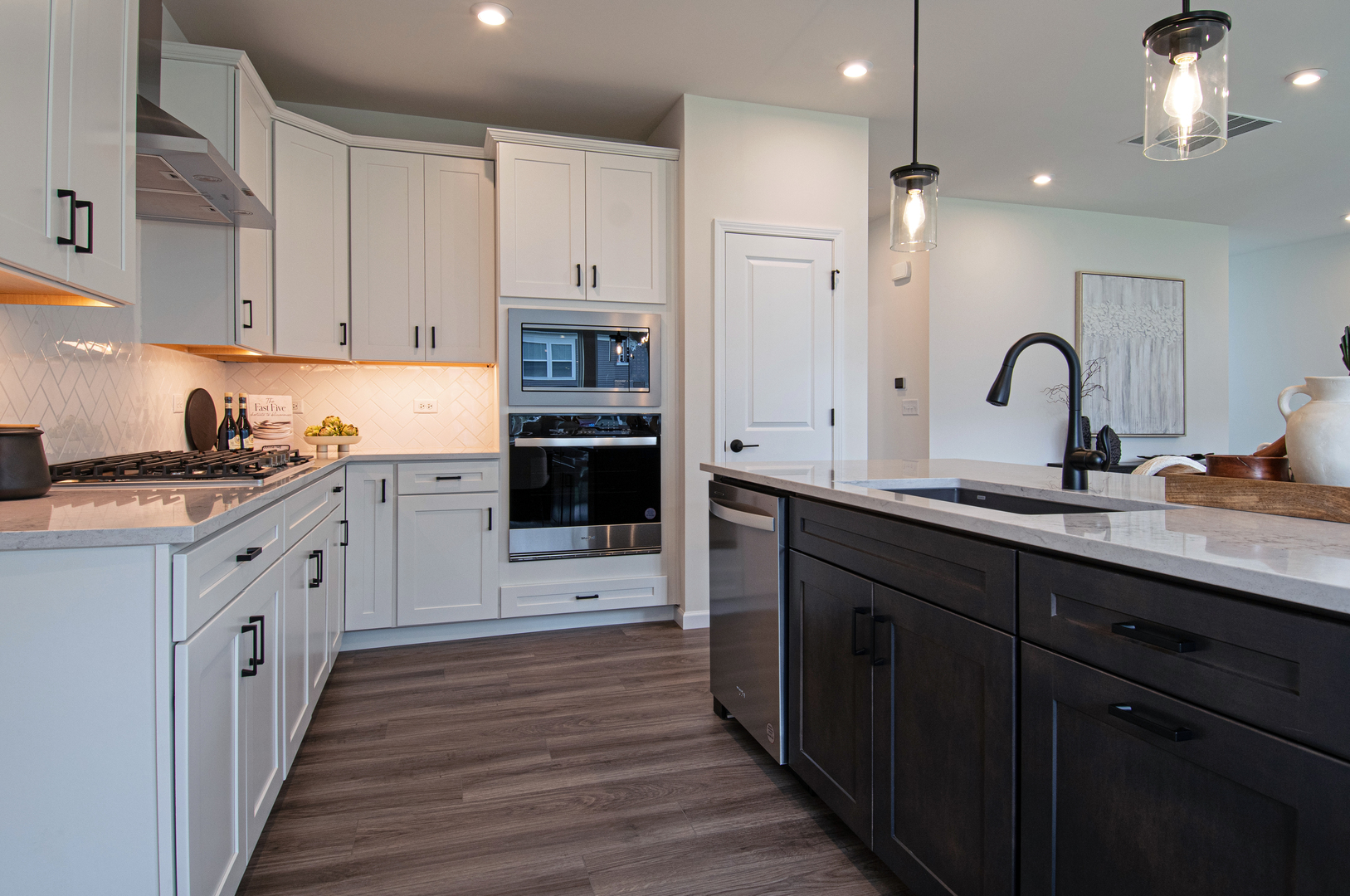 2244 Quartet Road Plainfield, IL 60585 - Photo 7 of 18 a kitchen with kitchen island granite countertop a sink cabinets and stainless steel appliances