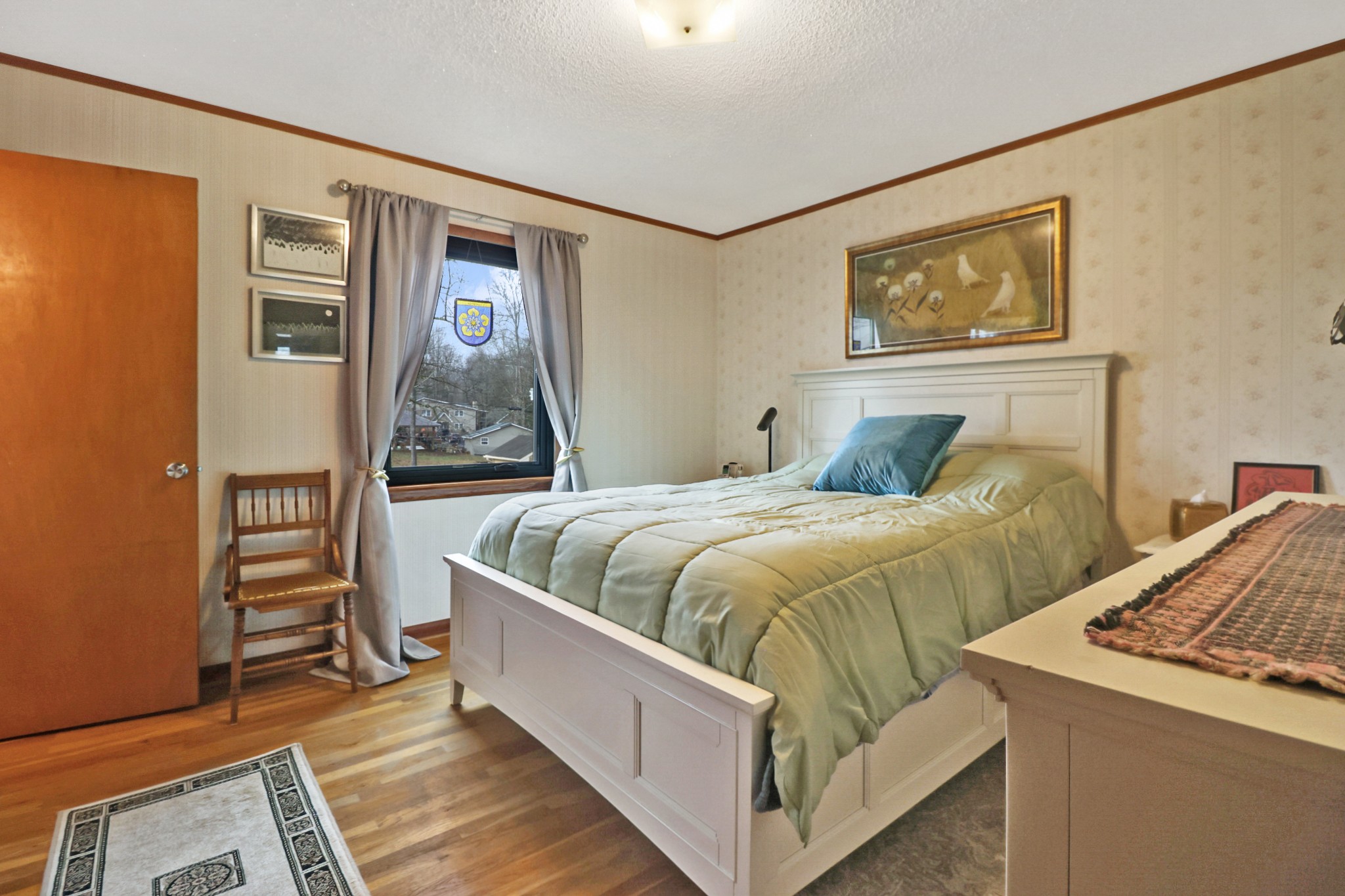 1209 Sequatchie Road Pikeville, TN 37367 - Photo 13 of 40 a bedroom with a bed and a painting on the wall