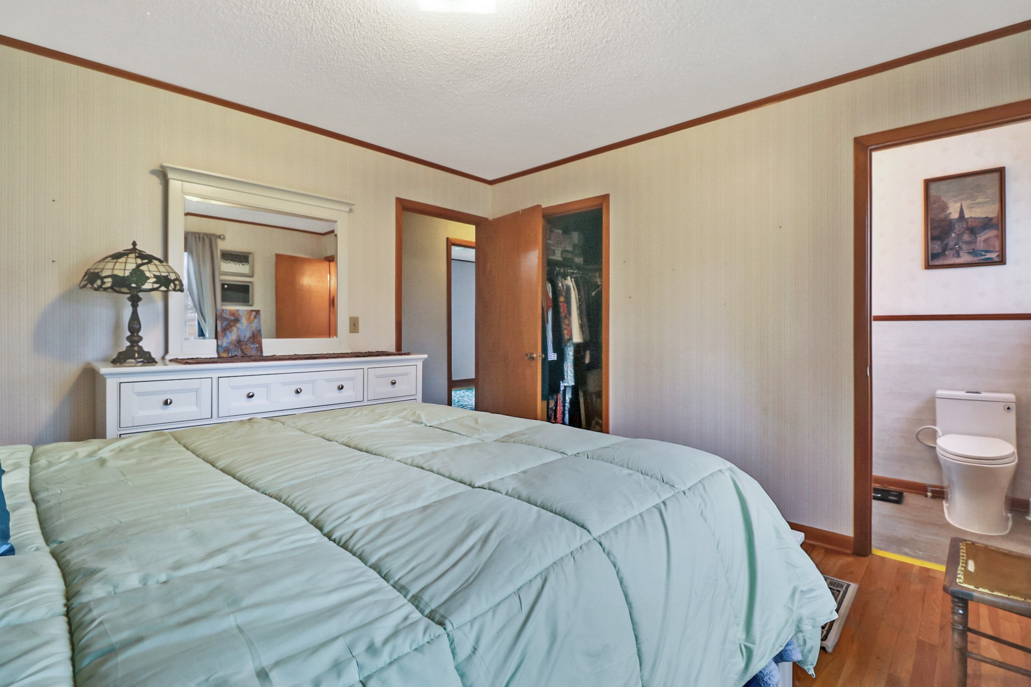 1209 Sequatchie Road Pikeville, TN 37367 - Photo 14 of 40 a bedroom with a bed and a large mirror on the dresser