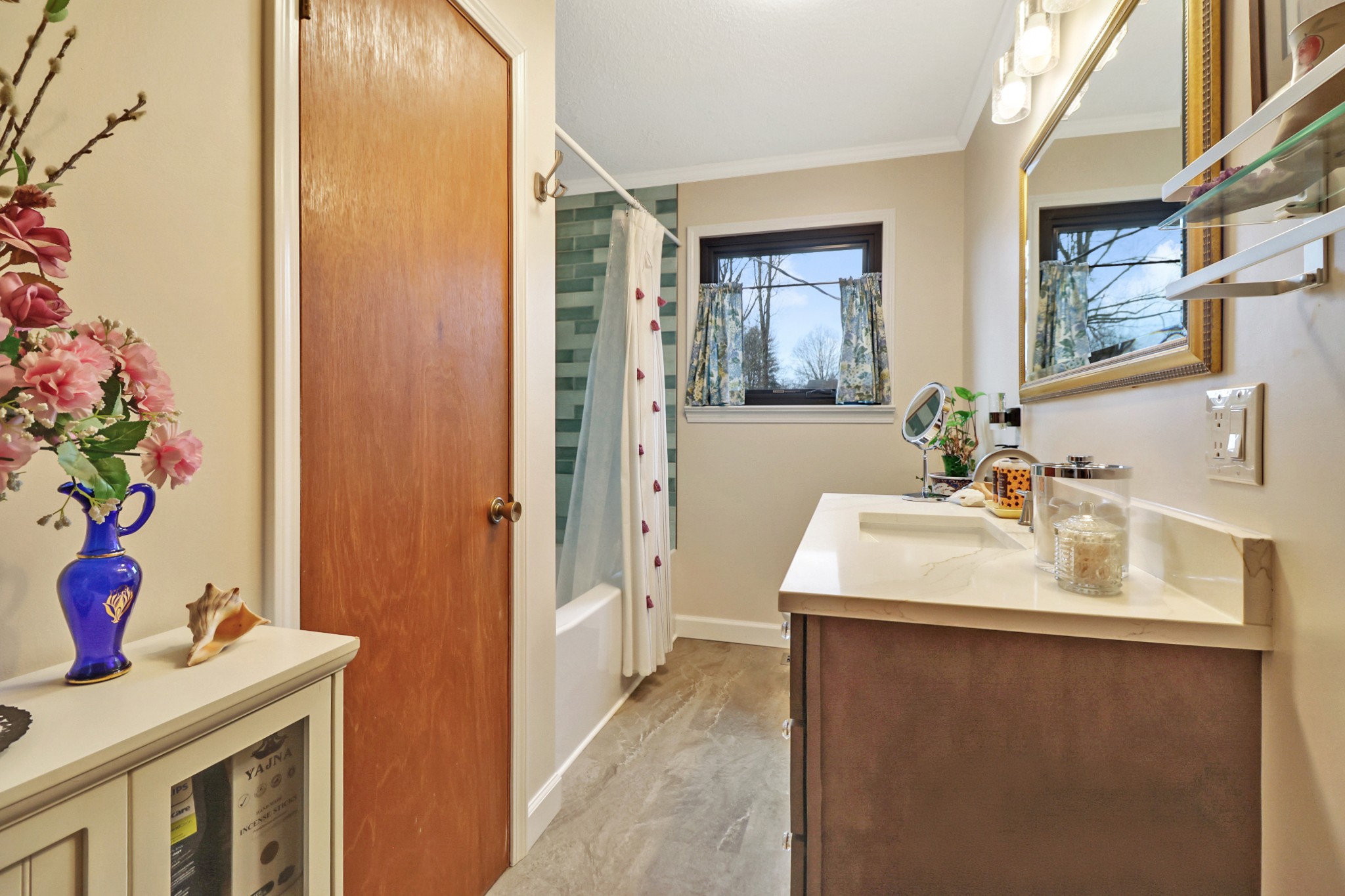 1209 Sequatchie Road Pikeville, TN 37367 - Photo 15 of 40 a en suite bathroom with a granite countertop sink a mirror and a shower