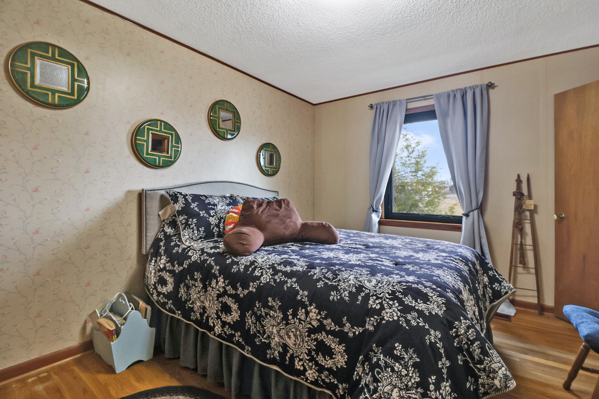 1209 Sequatchie Road Pikeville, TN 37367 - Photo 17 of 40 a bed sitting in a bedroom next to a window