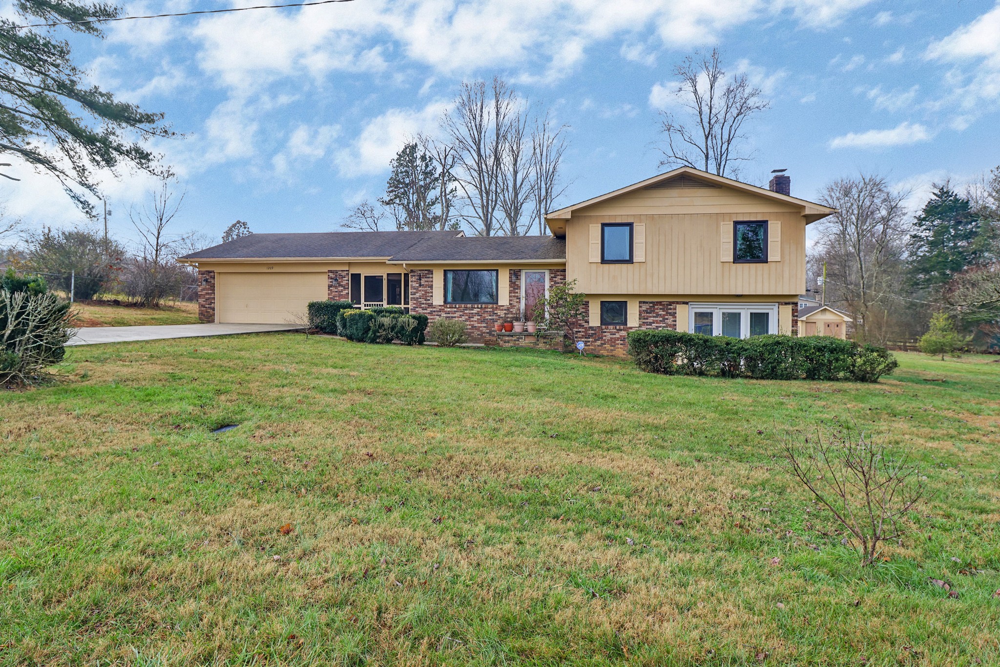 1209 Sequatchie Road Pikeville, TN 37367 - Photo 2 of 40 a front view of a house with a yard
