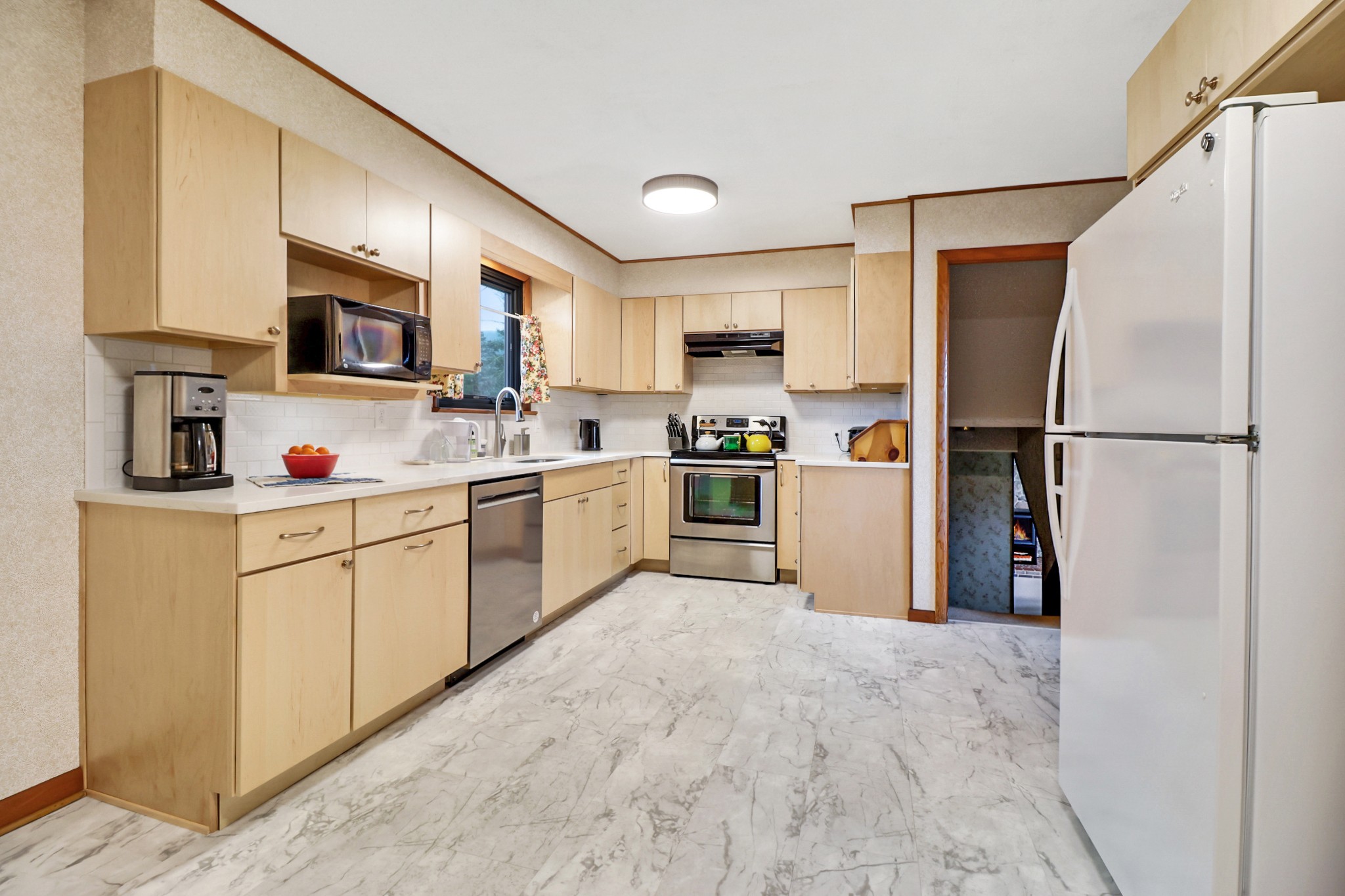 1209 Sequatchie Road Pikeville, TN 37367 - Photo 6 of 40 a kitchen with stainless steel appliances granite countertop a refrigerator sink and cabinets