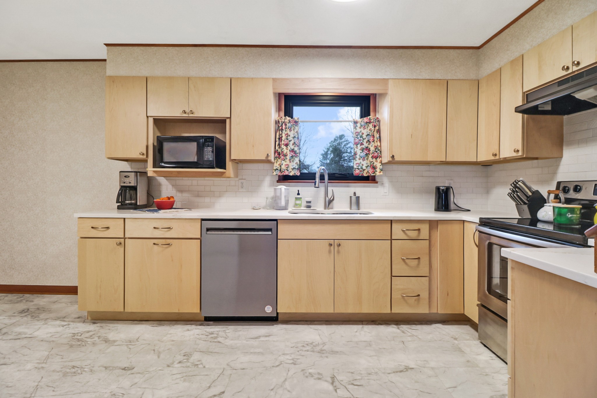 1209 Sequatchie Road Pikeville, TN 37367 - Photo 7 of 40 a kitchen with a sink stove and microwave