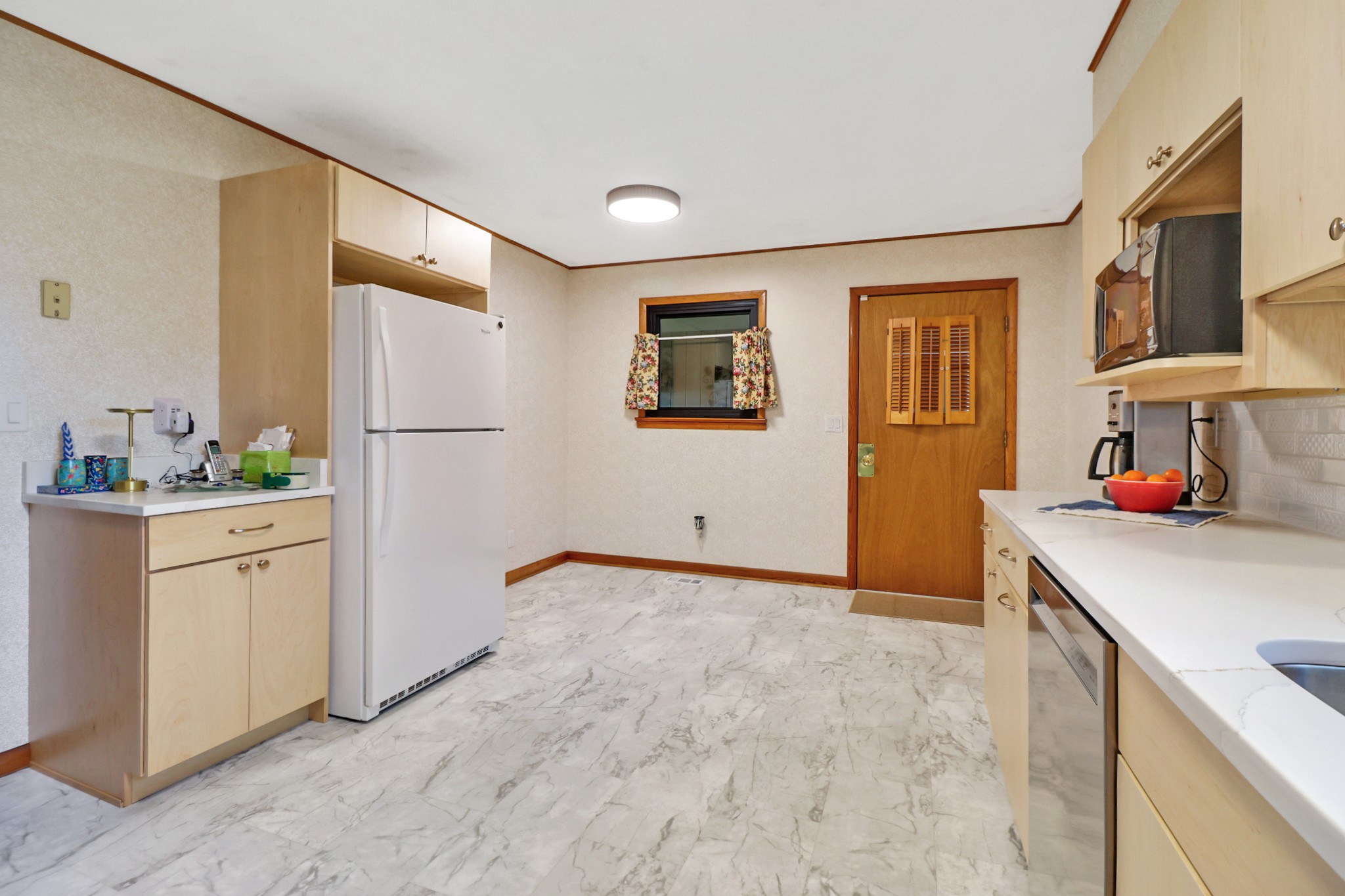 1209 Sequatchie Road Pikeville, TN 37367 - Photo 8 of 40 a kitchen with white cabinets and refrigerator