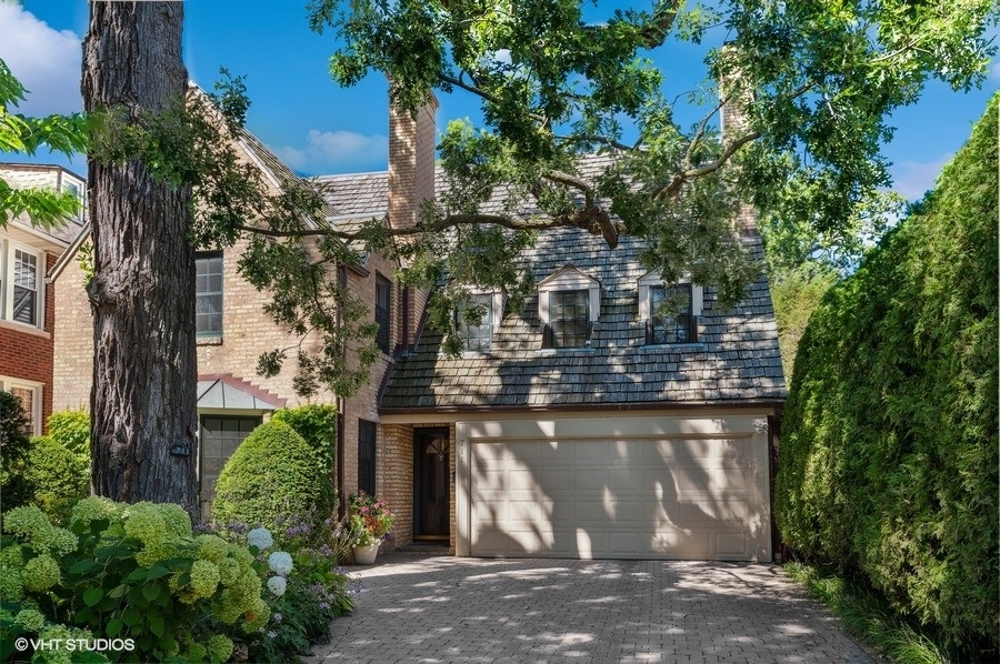 711 Lincoln Street Evanston, IL 60201 - Photo 1 of 34 a view of a house with a tree