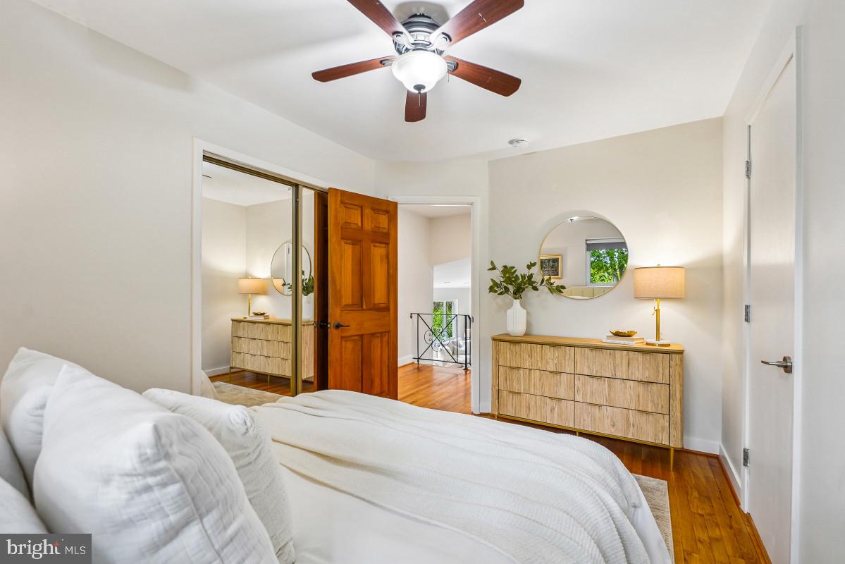 827 Caddington Avenue Silver Spring, MD 20901 - Photo 22 of 45 a bedroom with a bed and a chandelier