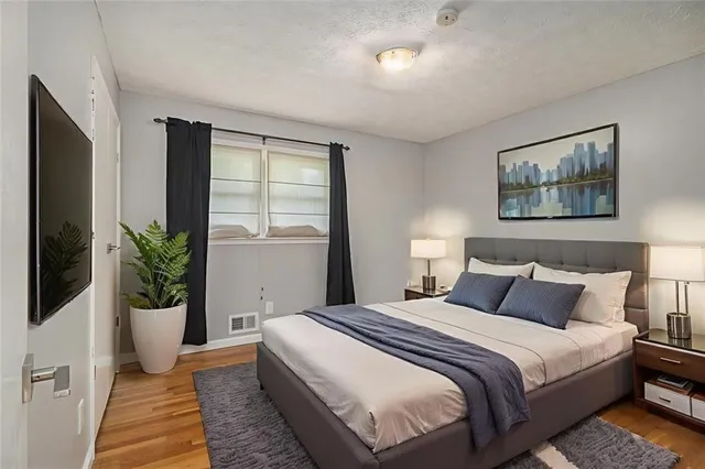 a front view of a house with a yard table and chairs
