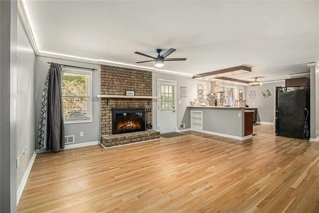 a view of a room with wooden floor and stairs
