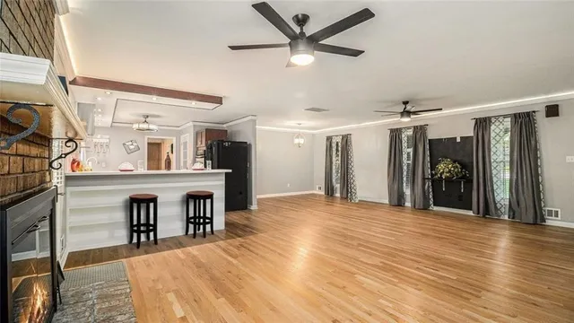 a view of a room with wooden floor and cabinet