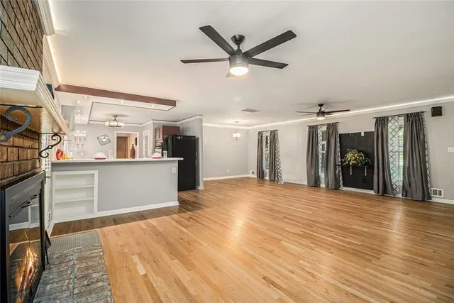 a bedroom with a bed window and a flat screen tv