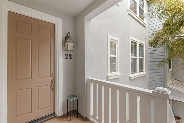 a view of a porch with wooden floor and fence