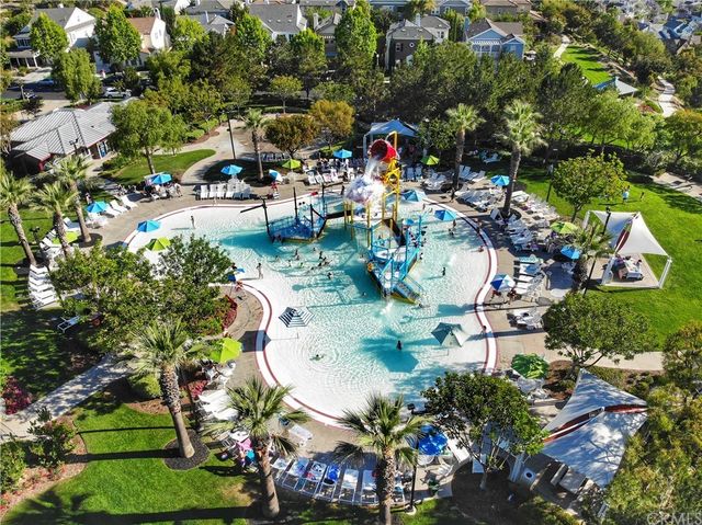 an outdoor space with seating area and swimming pool