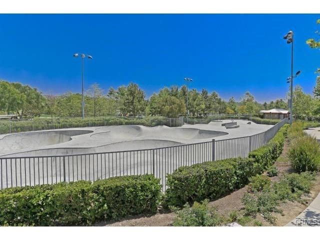 a view of a lake with houses in the back