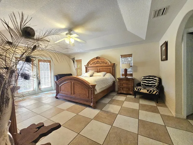 a bedroom with a bed and a desk