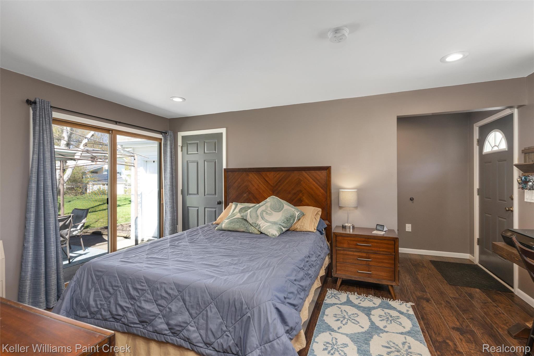 310 Elmhill Road Rochester, MI 48306 - Photo 20 of 37 Bedroom featuring dark wood-style floors, access to exterior, and recessed lighting