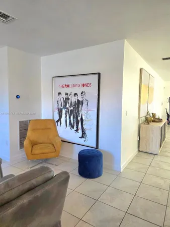 a spacious bedroom with a bed and a couch