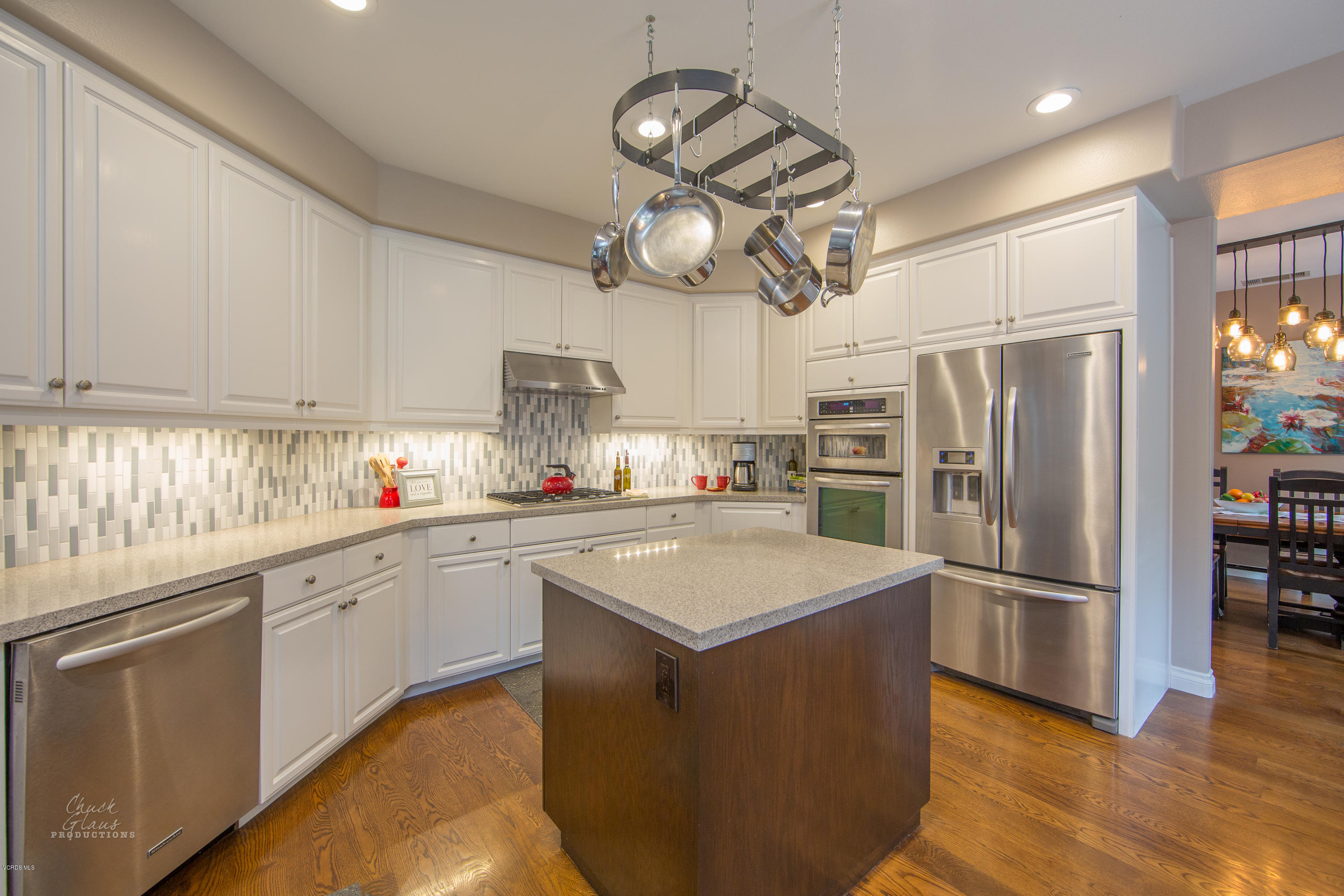 2073 Alborada Drive Camarillo, CA 93010 - Photo 12 of 51 a kitchen with stainless steel appliances granite countertop a refrigerator a sink dishwasher a stove and white cabinets