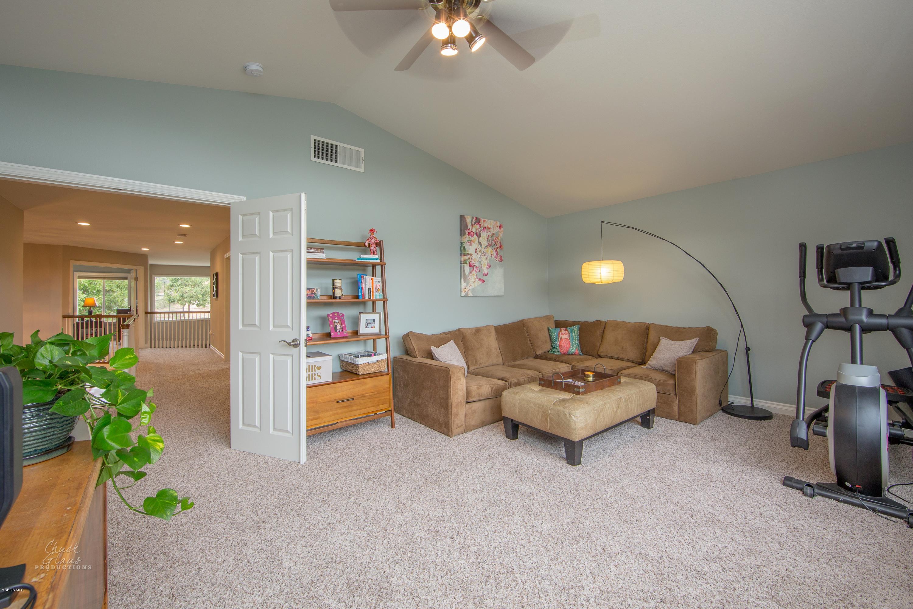 2073 Alborada Drive Camarillo, CA 93010 - Photo 27 of 51 a living room with furniture and a chandelier