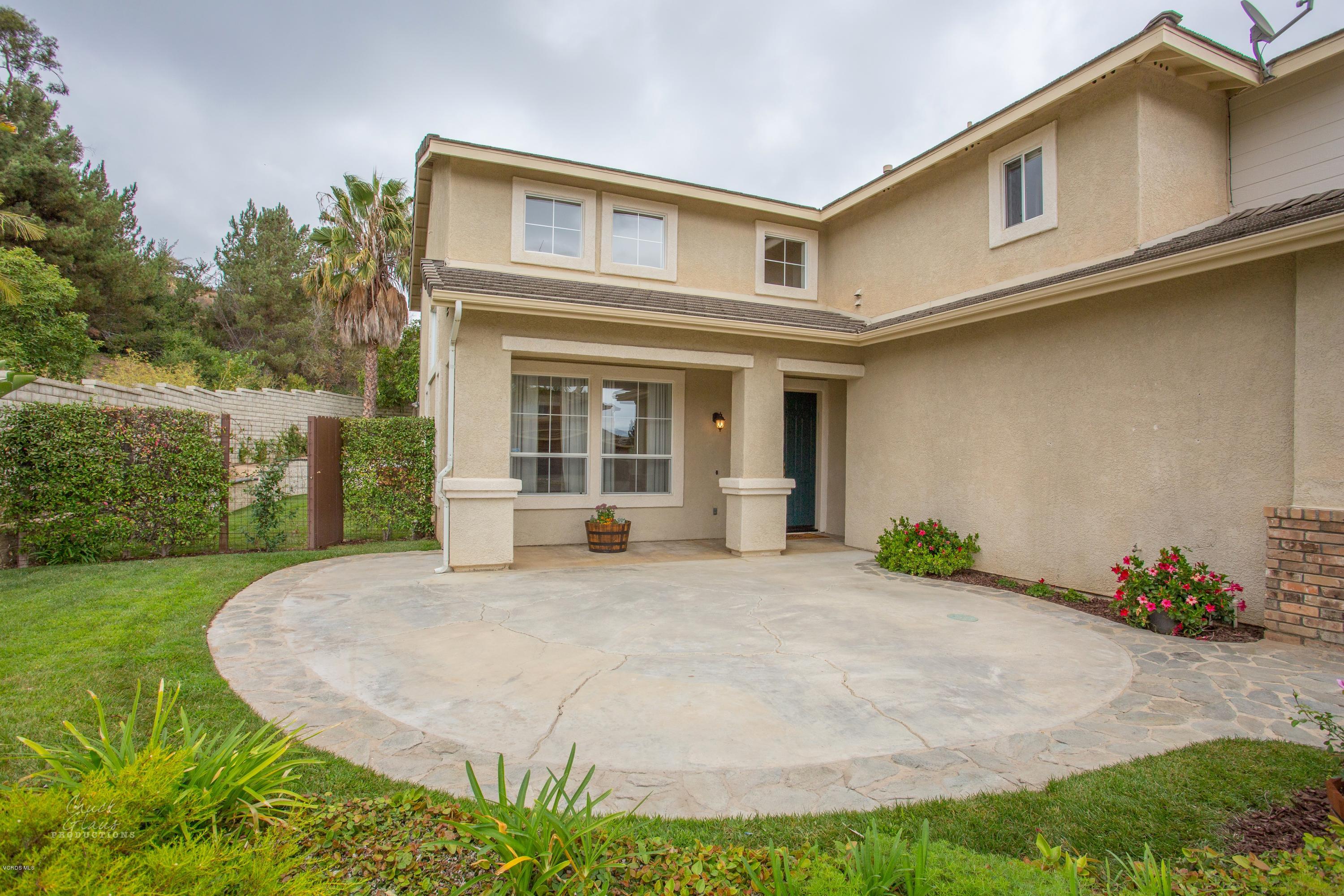 2073 Alborada Drive Camarillo, CA 93010 - Photo 4 of 51 a front view of a house with a garden and plants