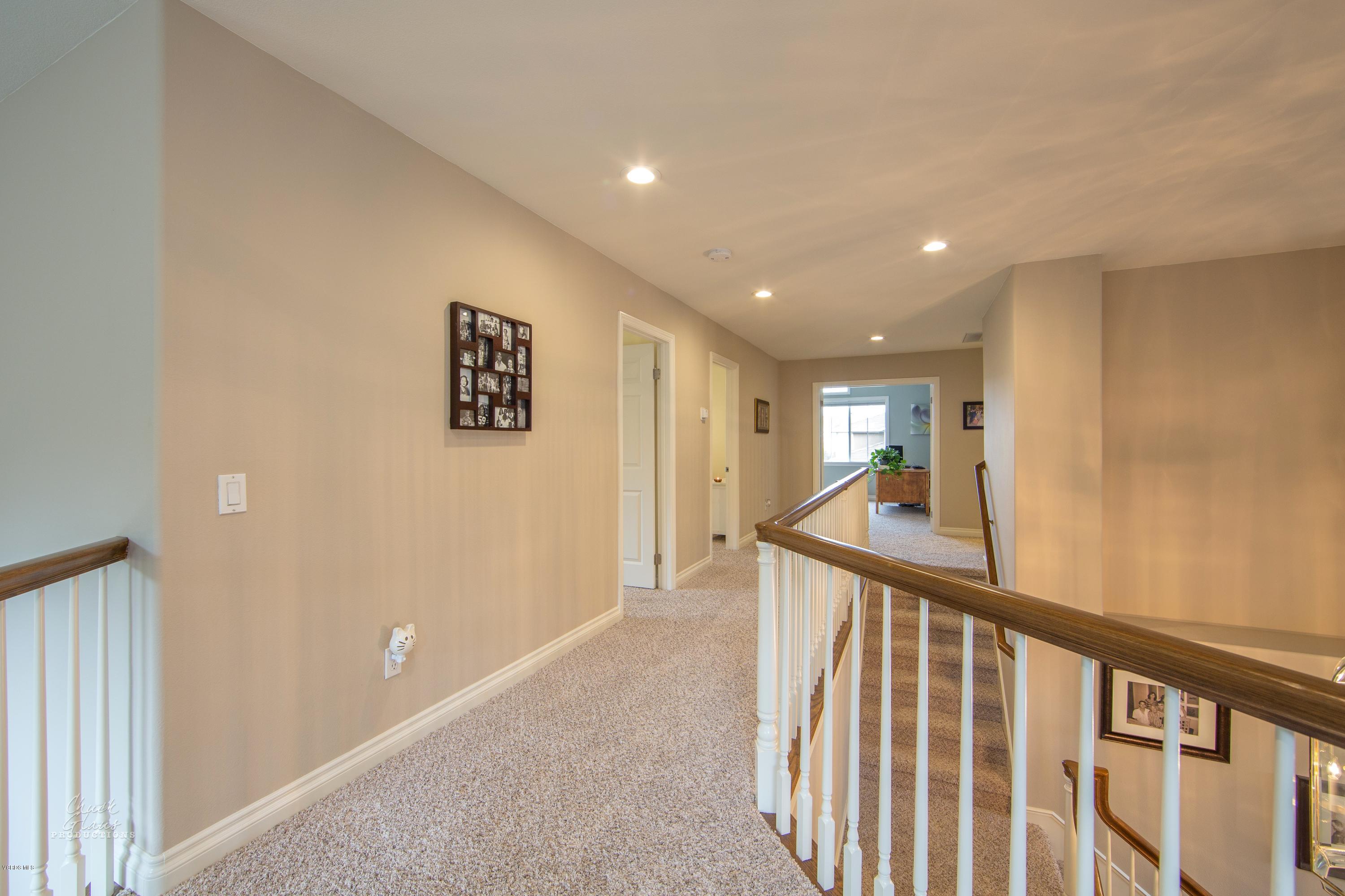 2073 Alborada Drive Camarillo, CA 93010 - Photo 31 of 51 a view of a hallway with wooden floor and windows