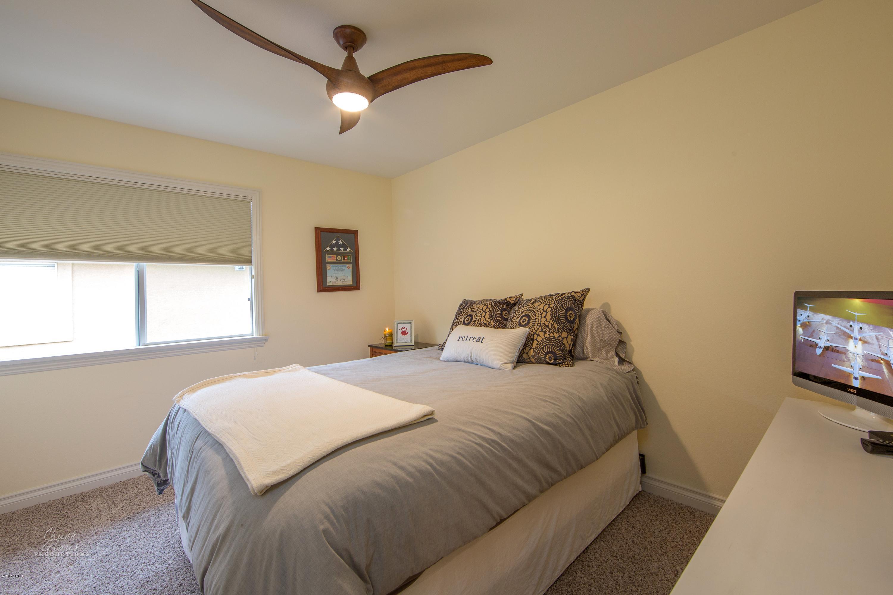 2073 Alborada Drive Camarillo, CA 93010 - Photo 33 of 51 a bedroom with a bed and a flat screen tv