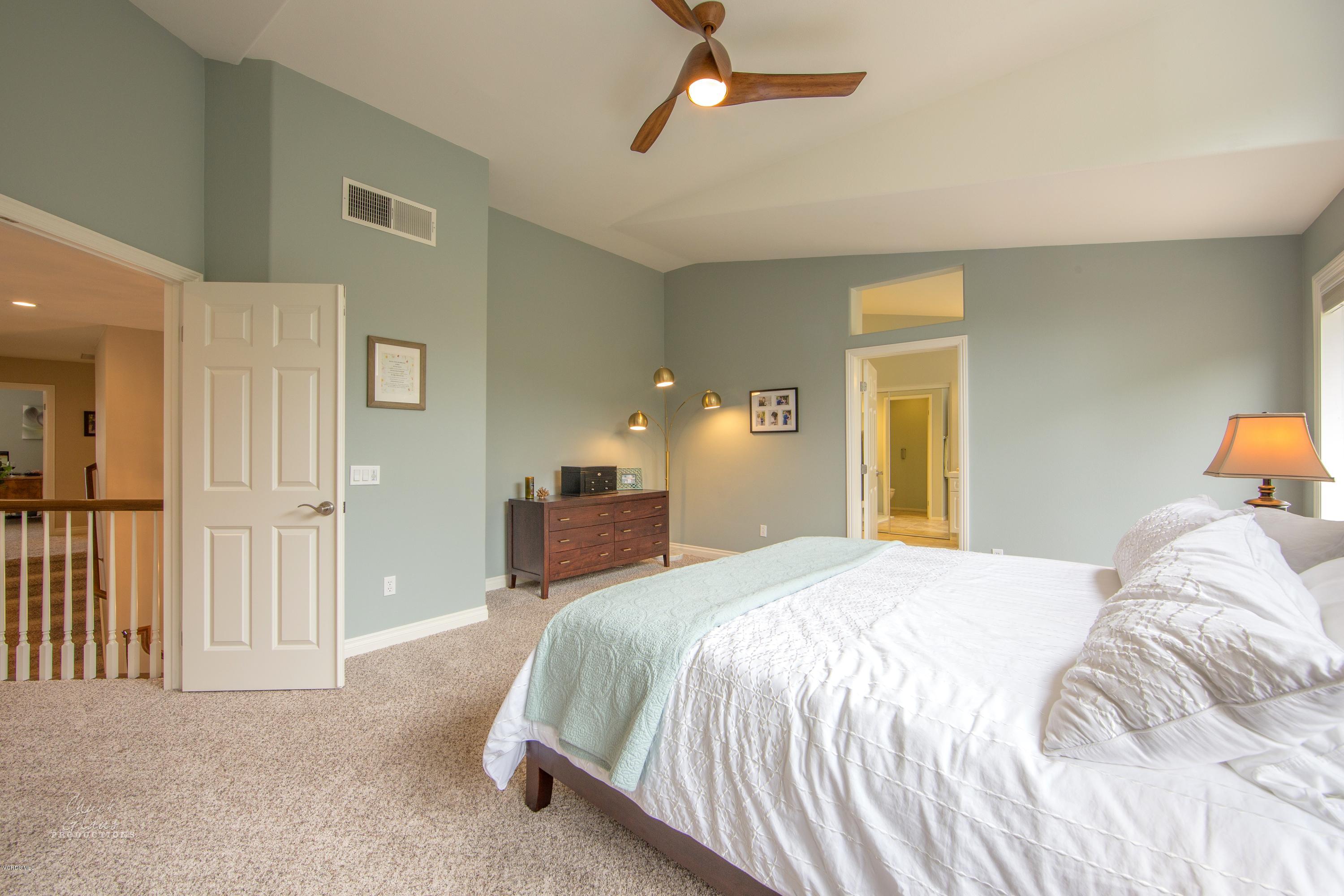 2073 Alborada Drive Camarillo, CA 93010 - Photo 38 of 51 a bedroom with a bed and wooden floor