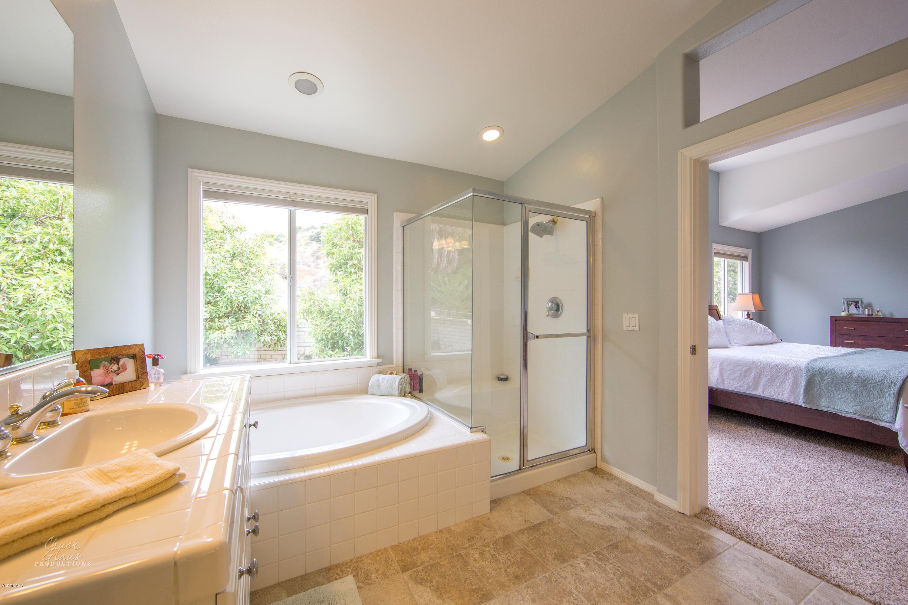 2073 Alborada Drive Camarillo, CA 93010 - Photo 41 of 51 a bathroom with a tub shower and sink