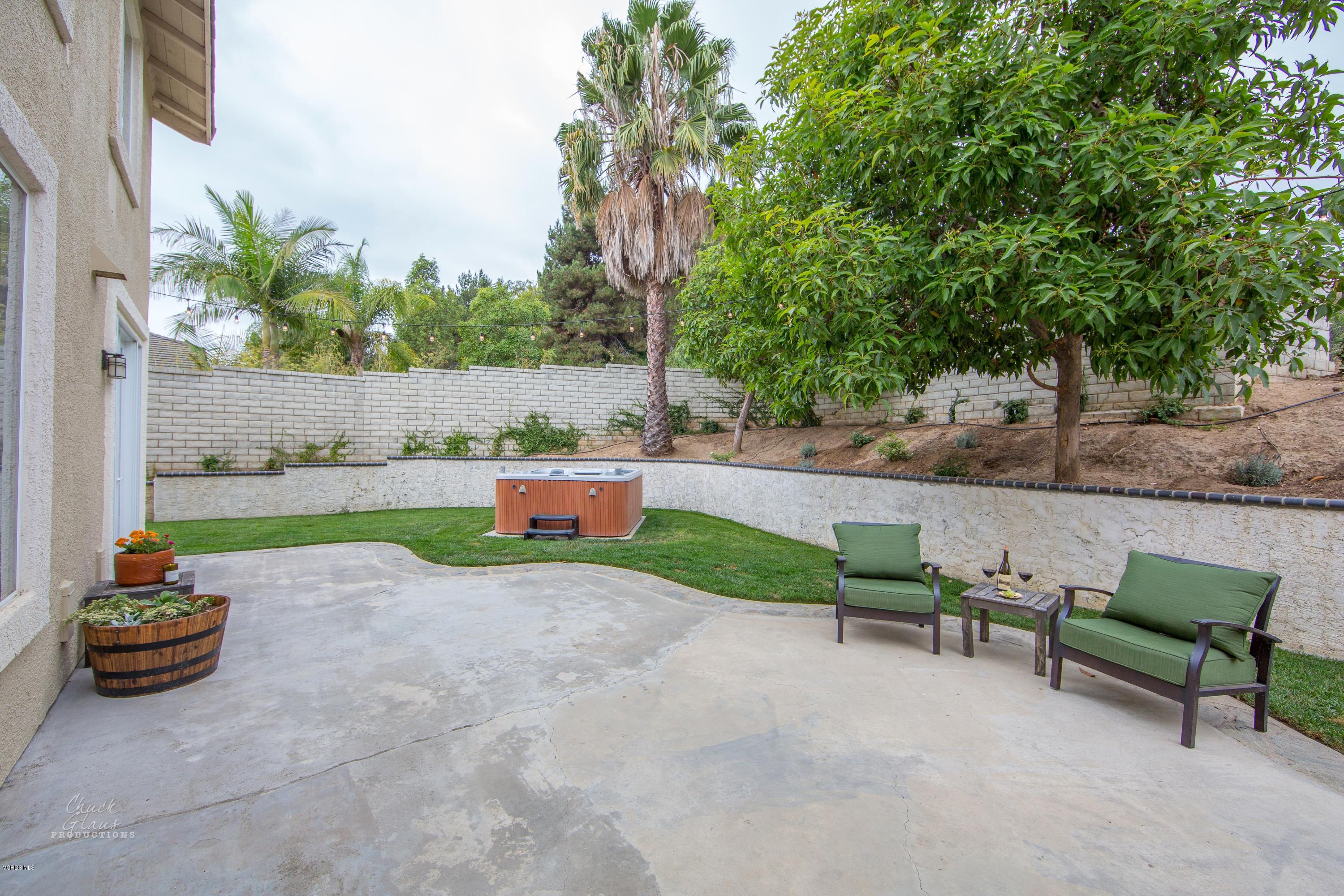 2073 Alborada Drive Camarillo, CA 93010 - Photo 45 of 51 a backyard of a house with table and chairs