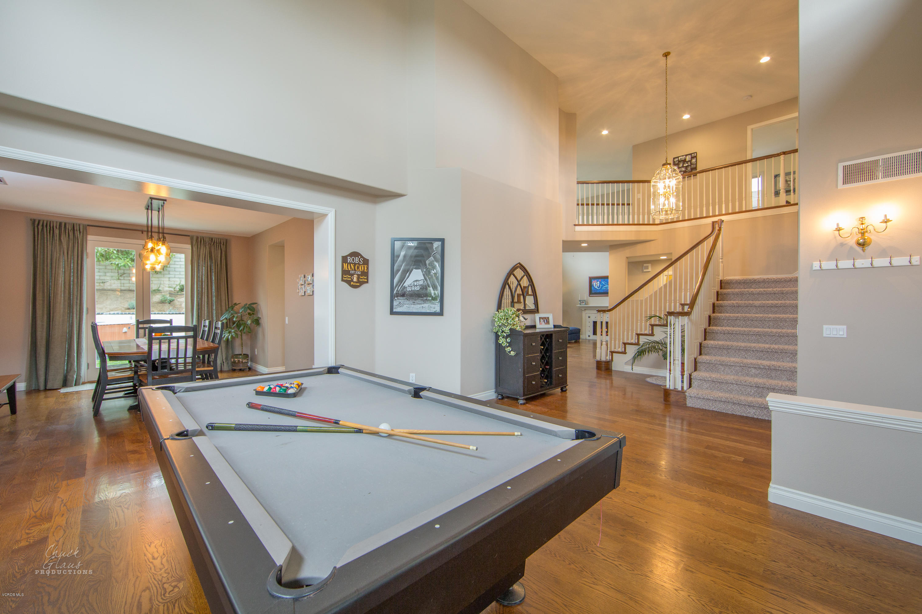 2073 Alborada Drive Camarillo, CA 93010 - Photo 7 of 51 a room with wooden floor table and chairs