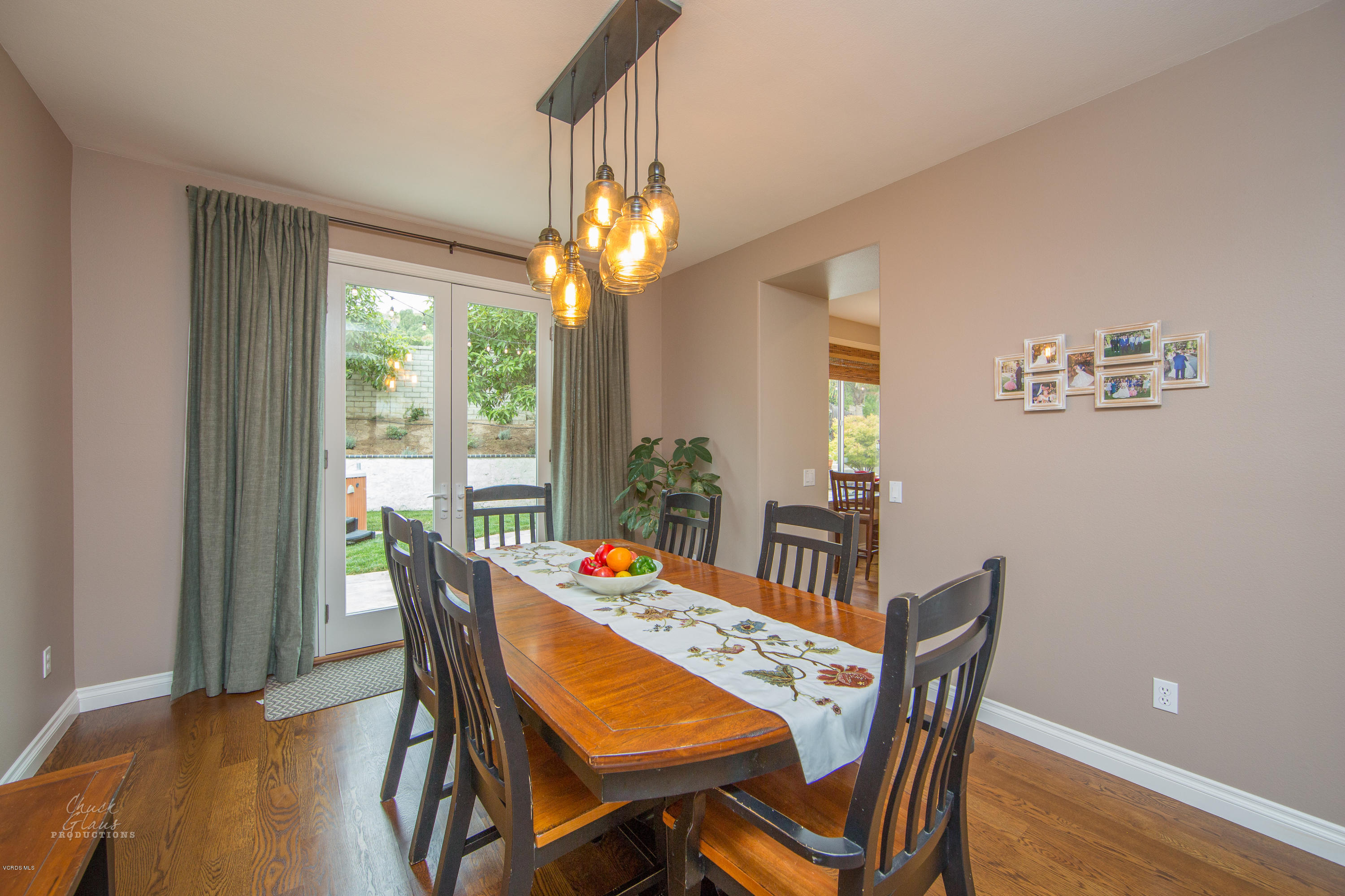 2073 Alborada Drive Camarillo, CA 93010 - Photo 9 of 51 a dining room with furniture a chandelier and wooden floor