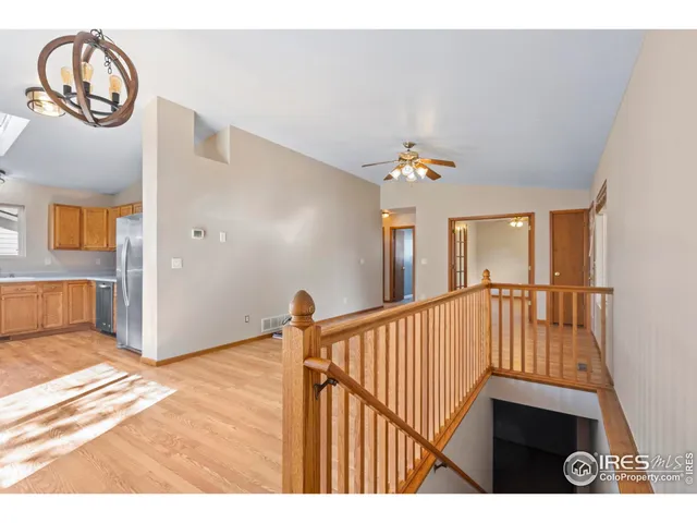 a view interior of a house with wooden floor windows and a chandelier