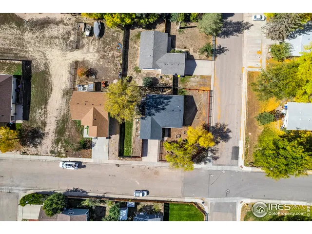 an aerial view of a house with a swimming pool