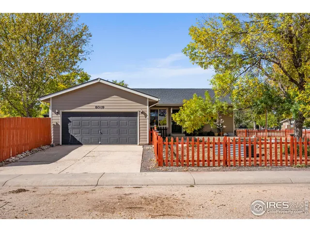 a view of a house with a small yard