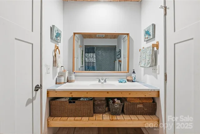 a bathroom with a sink and a mirror