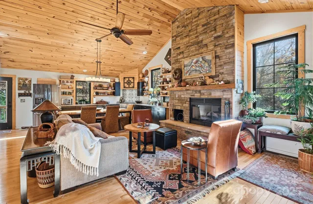 a living room with furniture fireplace and a flat screen tv