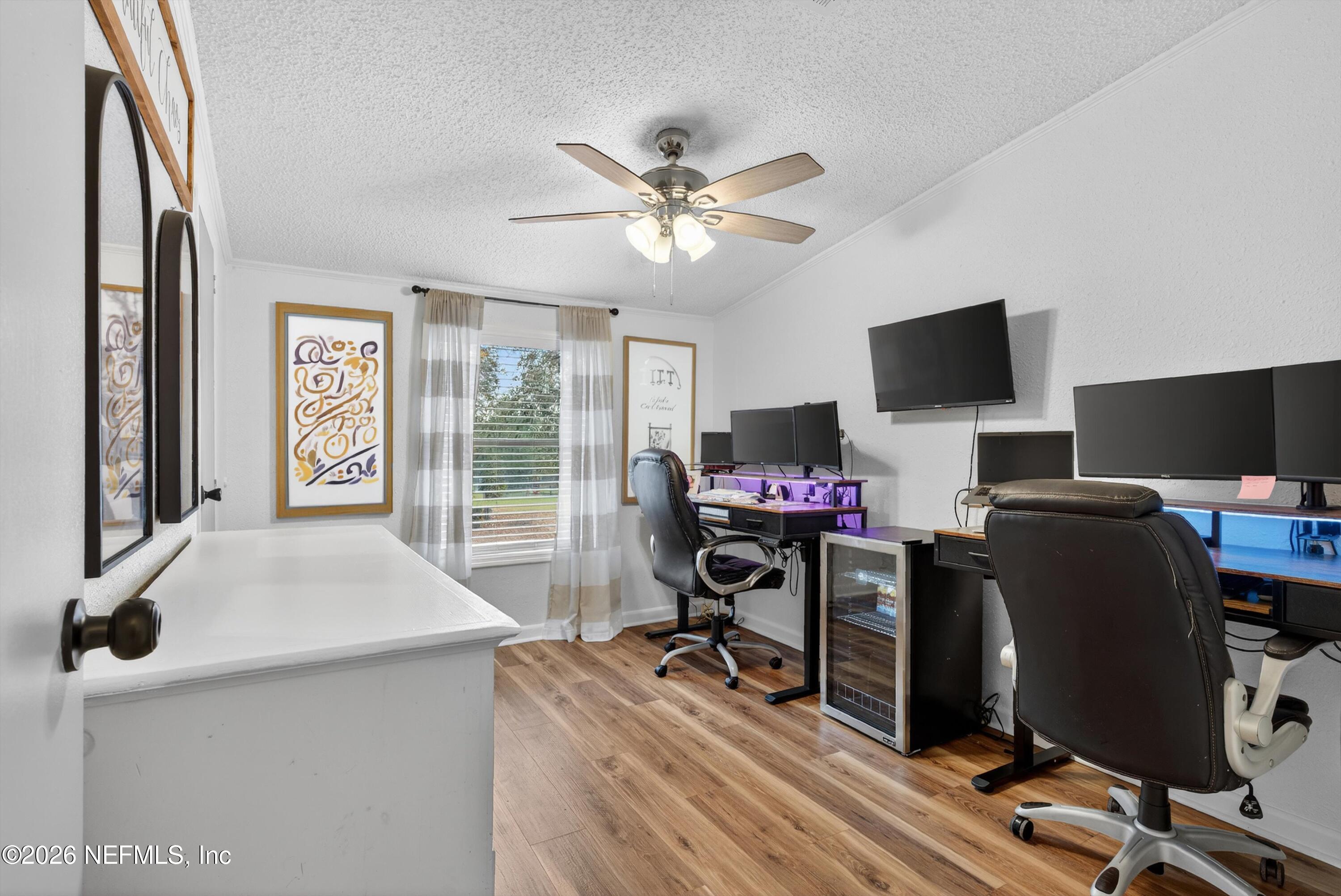 7655 Long Lake Road Keystone Heights, FL 32656 - Photo 13 of 58 a view of a workspace with furniture and a window