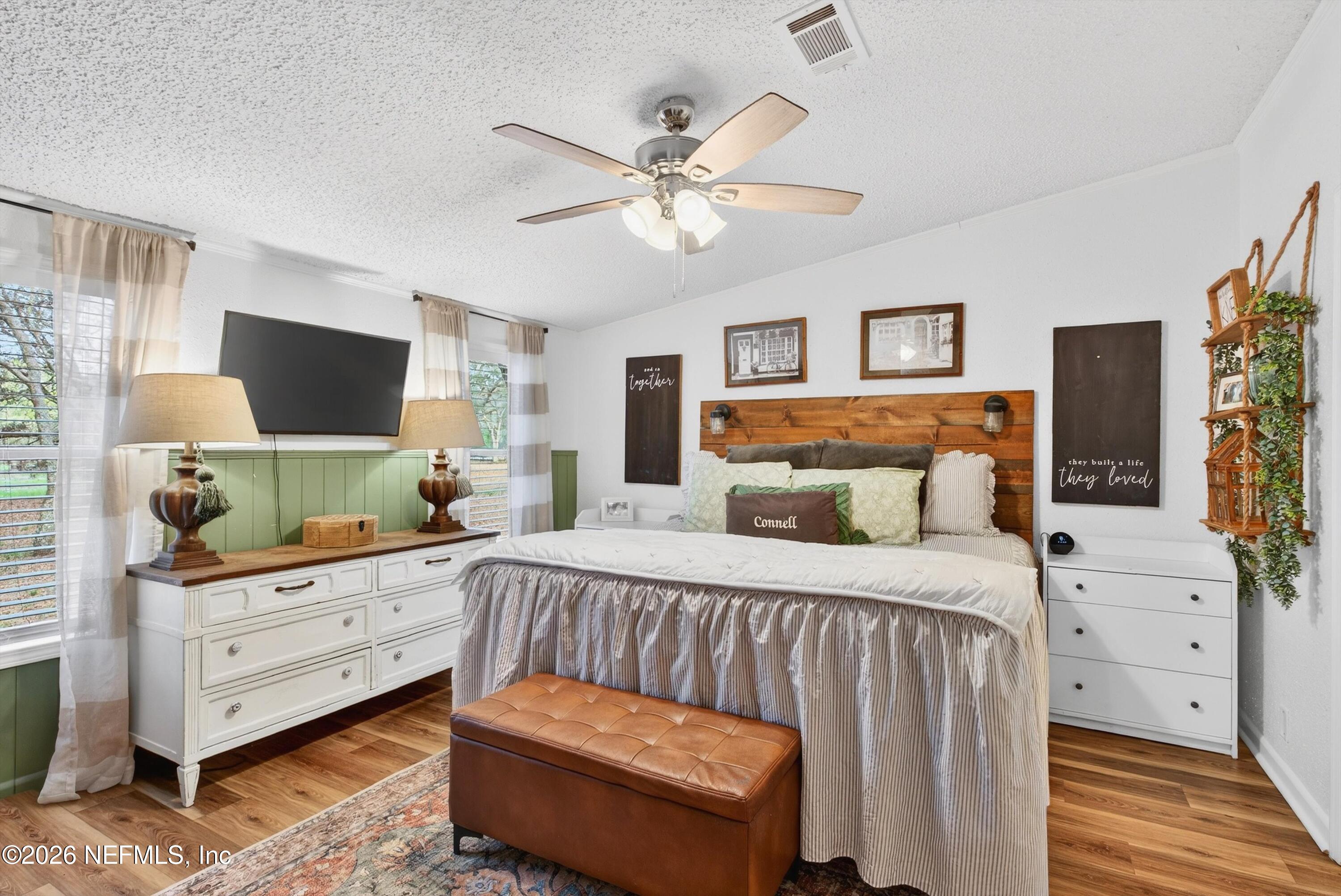 7655 Long Lake Road Keystone Heights, FL 32656 - Photo 18 of 58 a bedroom with a bed and a flat screen tv