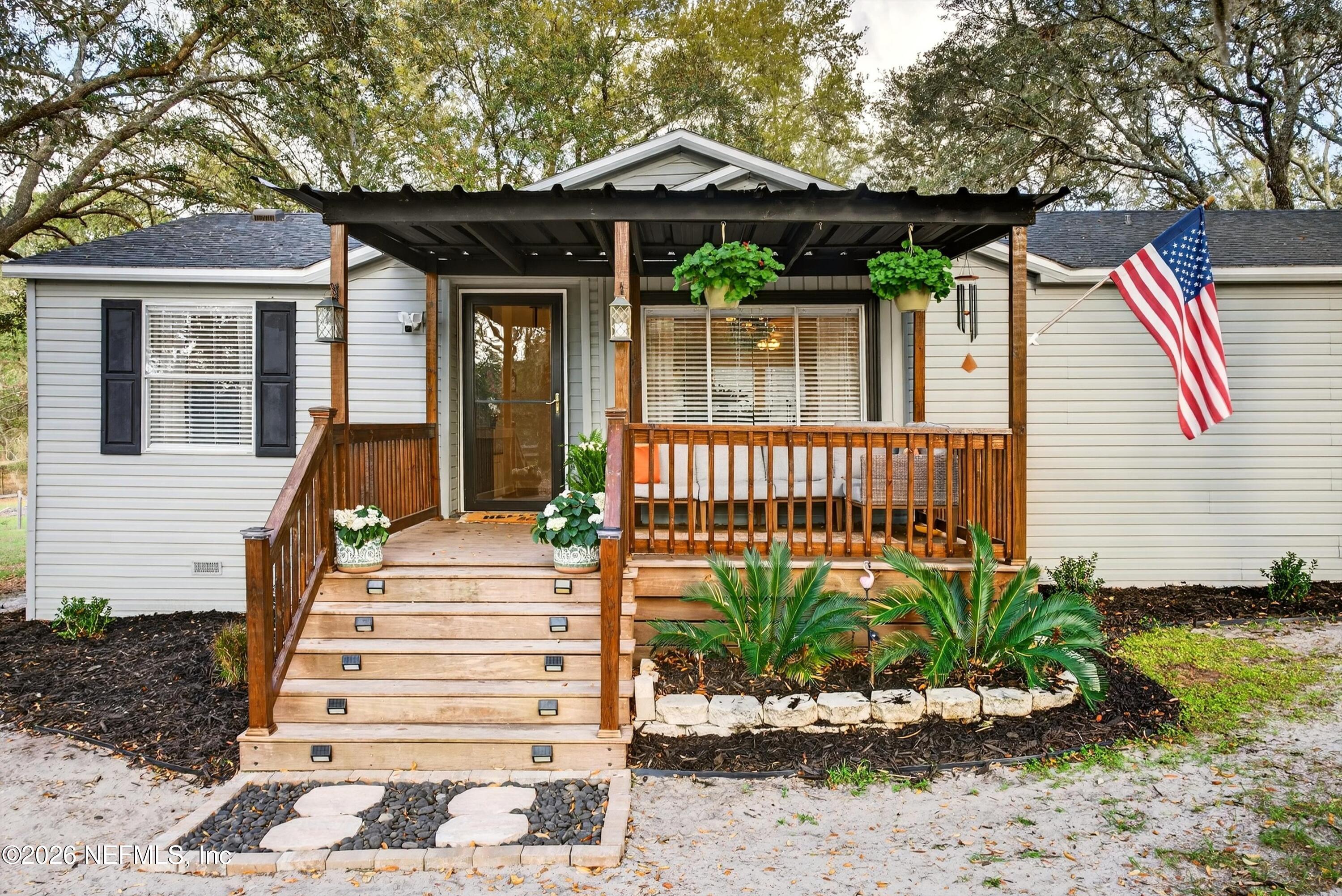 7655 Long Lake Road Keystone Heights, FL 32656 - Photo 4 of 58 a front view of a house with a yard