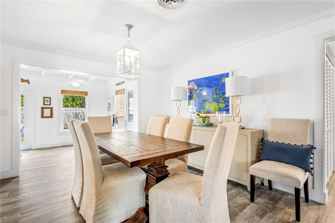 3816 Mockingbird Drive Vero Beach, FL 32963 - Photo 14 of 28 a view of a dining room with furniture and wooden floor