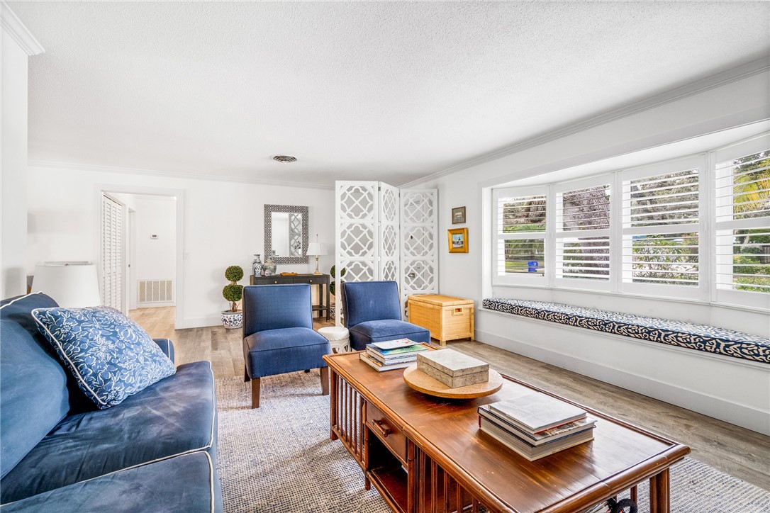 3816 Mockingbird Drive Vero Beach, FL 32963 - Photo 15 of 28 a living room with furniture and a large window