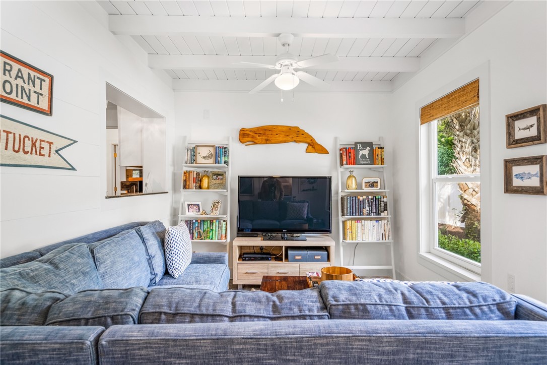 3816 Mockingbird Drive Vero Beach, FL 32963 - Photo 16 of 28 a living room with furniture and a flat screen tv