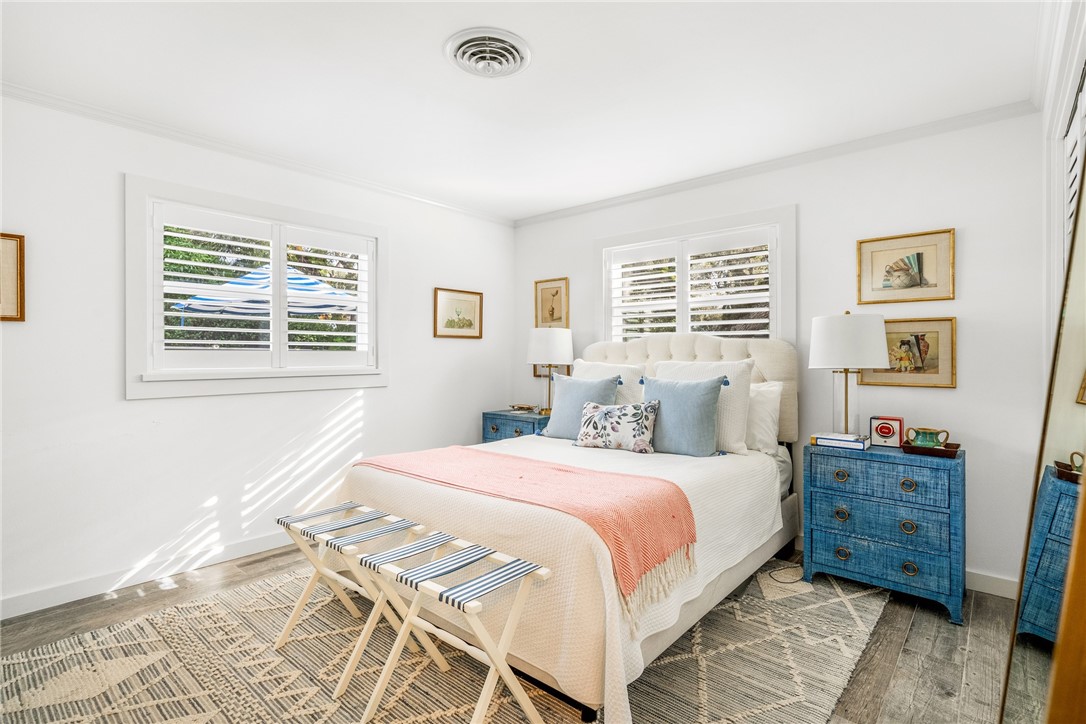 3816 Mockingbird Drive Vero Beach, FL 32963 - Photo 19 of 28 a bedroom with a bed dresser and a window