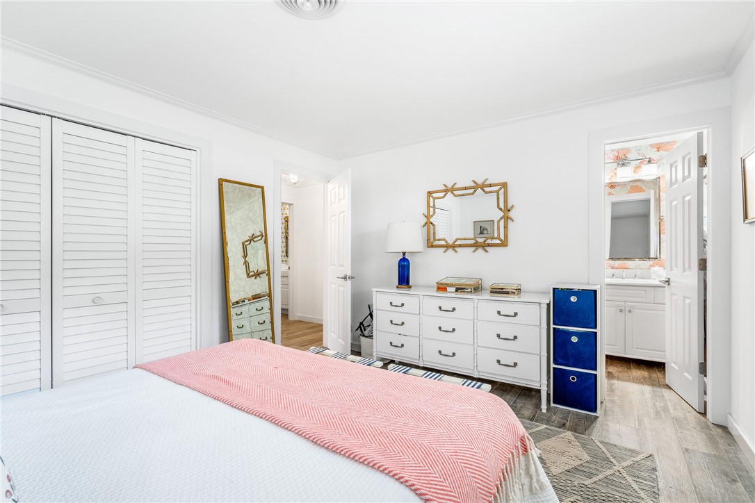 3816 Mockingbird Drive Vero Beach, FL 32963 - Photo 20 of 28 a bedroom with a bed and a dresser