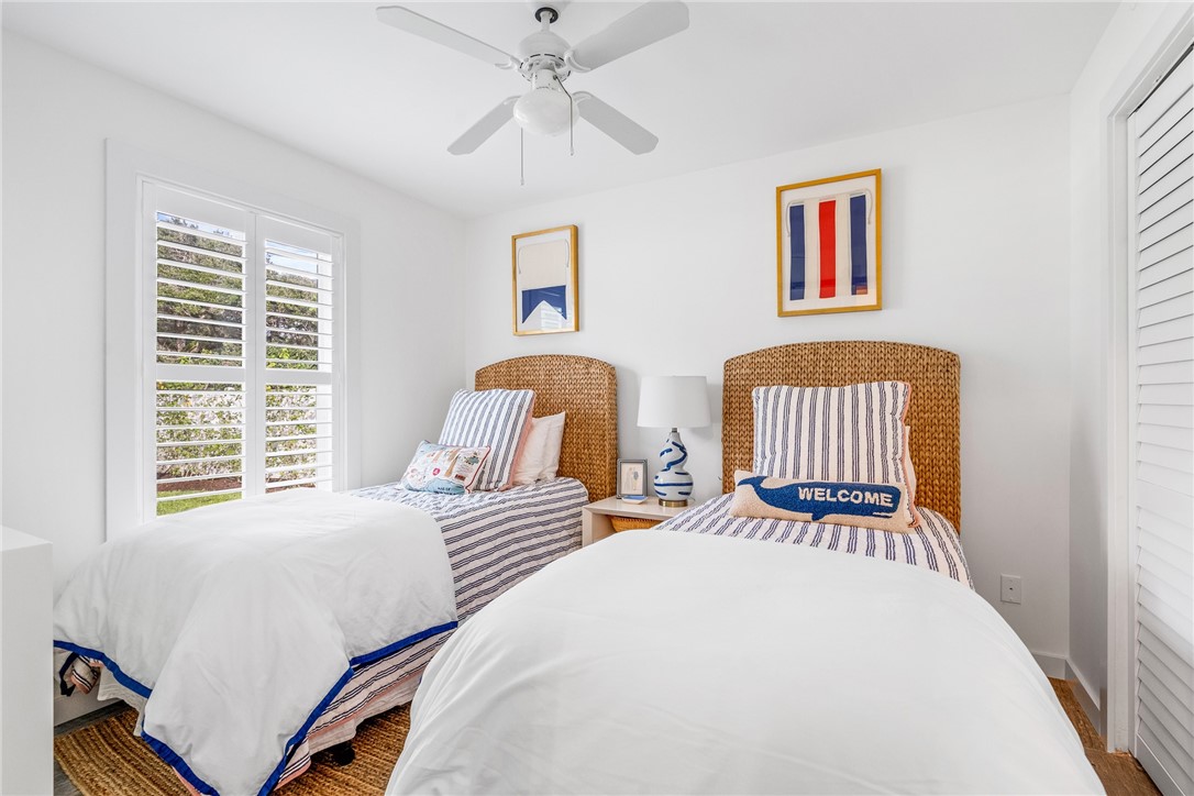 3816 Mockingbird Drive Vero Beach, FL 32963 - Photo 24 of 28 a bedroom with two beds and a window