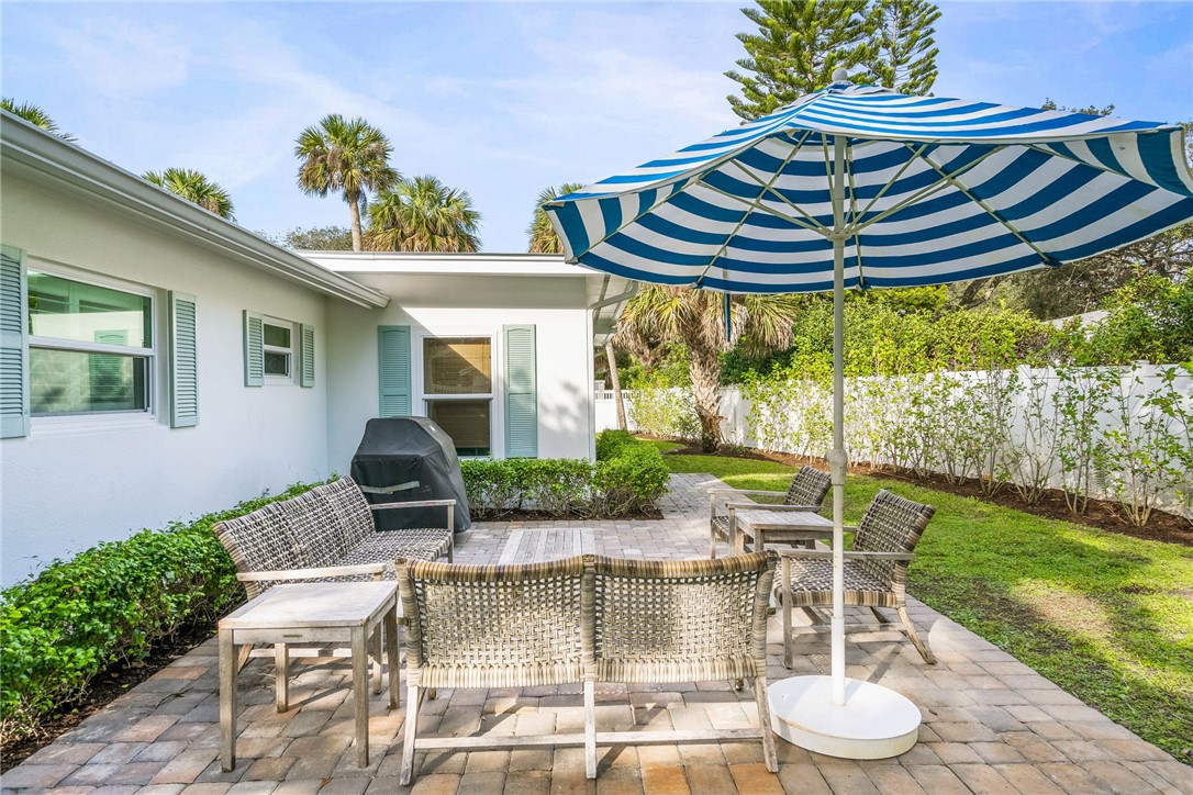3816 Mockingbird Drive Vero Beach, FL 32963 - Photo 26 of 28 a view of an chairs and tables in the patio