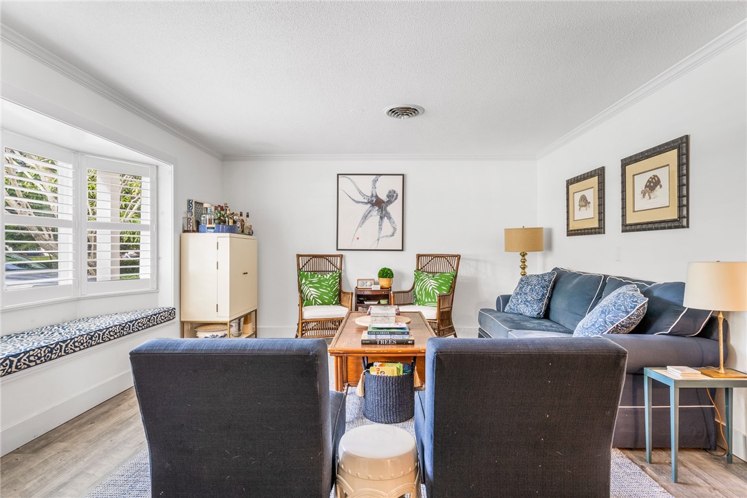 3816 Mockingbird Drive Vero Beach, FL 32963 - Photo 4 of 28 a living room with furniture and a large window