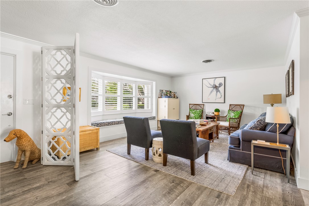 3816 Mockingbird Drive Vero Beach, FL 32963 - Photo 6 of 28 a living room with furniture and wooden floor