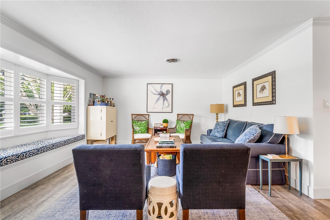 3816 Mockingbird Drive Vero Beach, FL 32963 - Photo 7 of 28 a living room with furniture and a large window