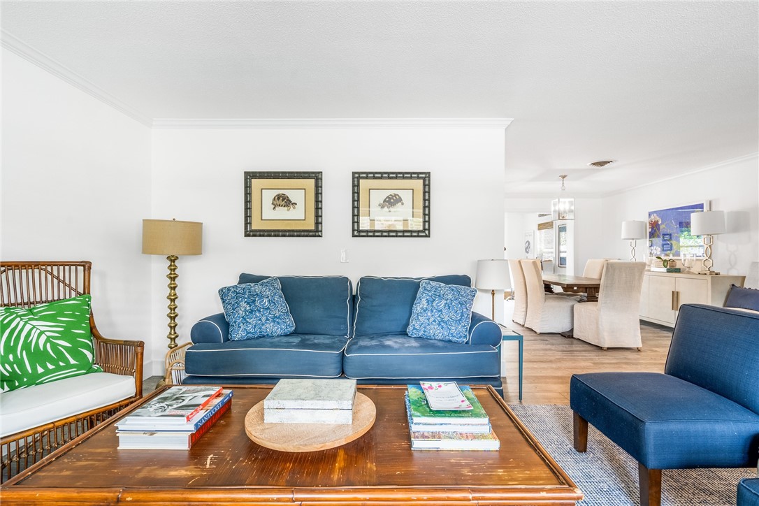 3816 Mockingbird Drive Vero Beach, FL 32963 - Photo 8 of 28 a living room with furniture and a rug